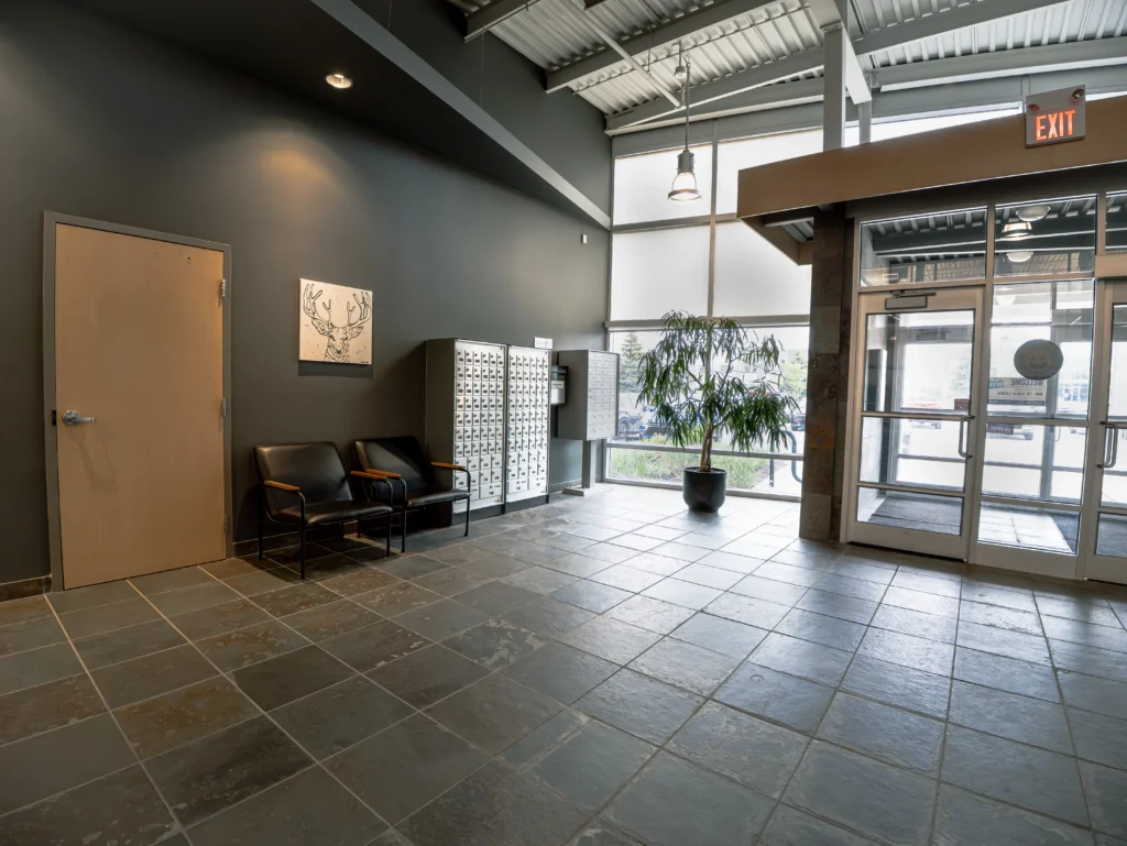 Modern lobby entrance at SuiteWorks in Barrie, Ontario featuring a welcoming reception area and contemporary business centre design.